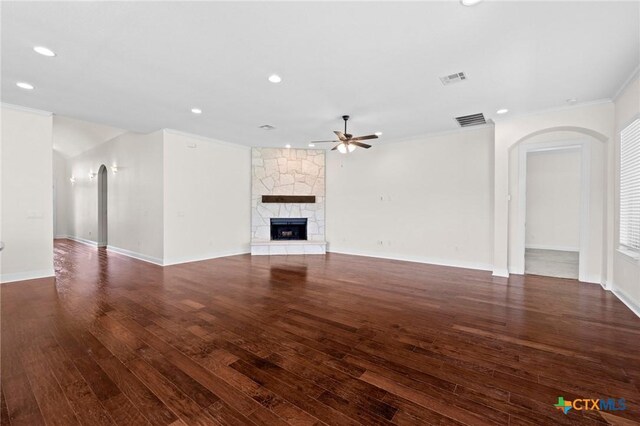200 Tate Ln, Round Rock, TX 78626 - unfurnished living room with arched walkways, ceiling fan, crown molding, wood-type flooring, and recessed lighting