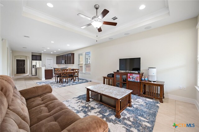 14000 Alloro Dr, Austin, TX 78717 - living room featuring baseboards, a tray ceiling, light tile patterned flooring, and ceiling fan