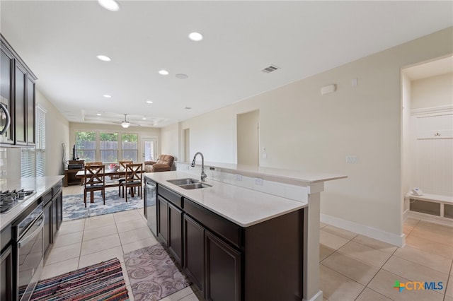 14000 Alloro Dr, Austin, TX 78717 - kitchen featuring visible vents, light tile patterned floors, a sink, light countertops, and stainless steel appliances