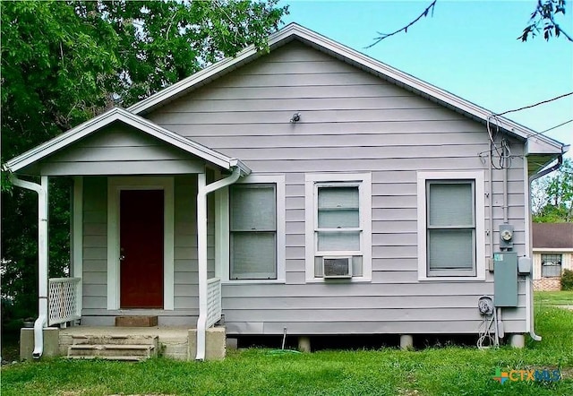 bungalow-style home featuring cooling unit