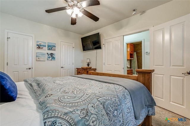 carpeted bedroom with ceiling fan