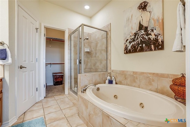 bathroom with separate shower and tub and tile patterned floors