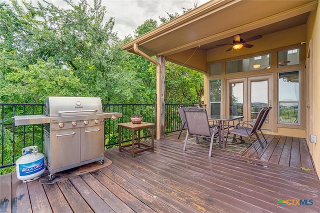 wooden terrace featuring ceiling fan