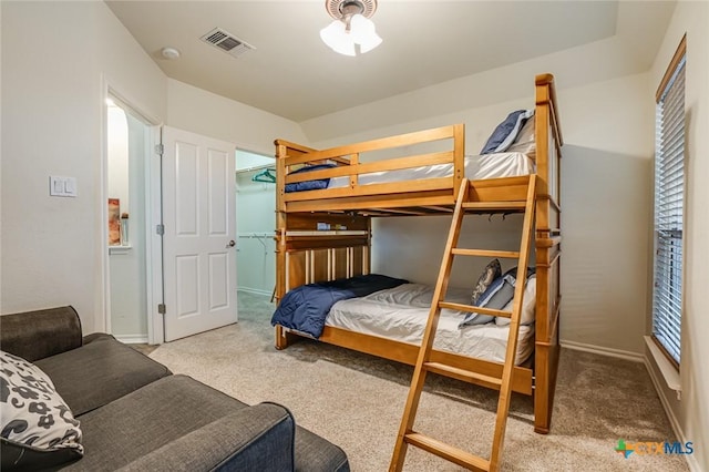 bedroom featuring light carpet