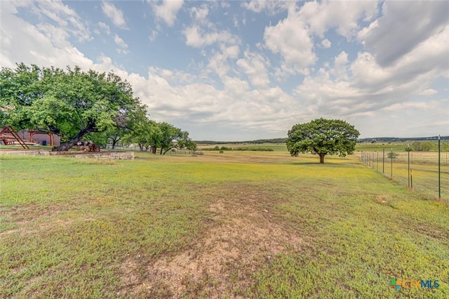 view of yard with a rural view