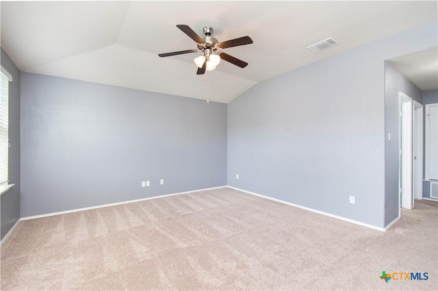 unfurnished room featuring carpet flooring, baseboards, a ceiling fan, and lofted ceiling