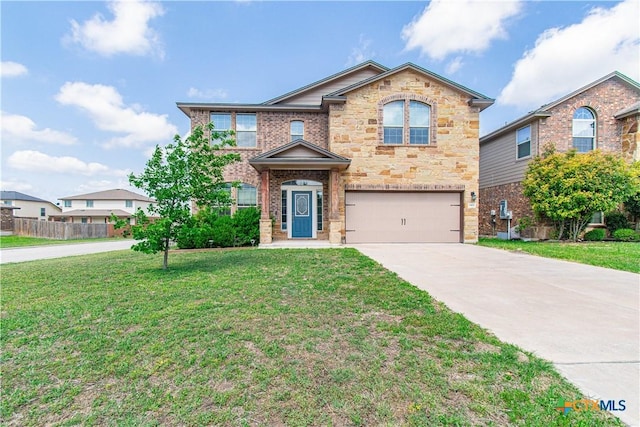 traditional-style house with driveway, stone siding, an attached garage, fence, and a front lawn