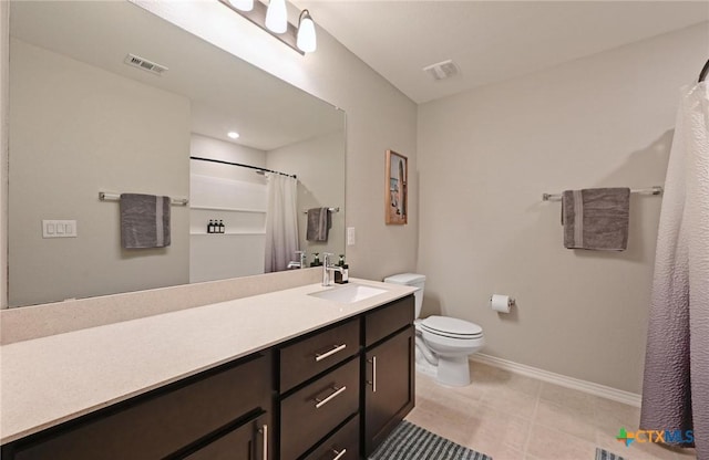 6309 Carriage Pines Dr, Del Valle, TX 78617 - bathroom with visible vents, toilet, vanity, and baseboards
