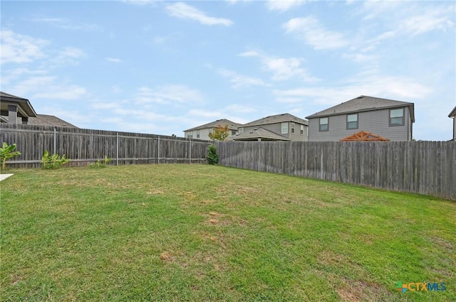 6309 Carriage Pines Dr, Del Valle, TX 78617 - view of yard with a residential view and a fenced backyard