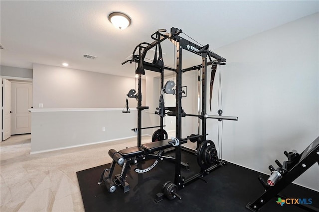 6309 Carriage Pines Dr, Del Valle, TX 78617 - workout room with light colored carpet, visible vents, and baseboards