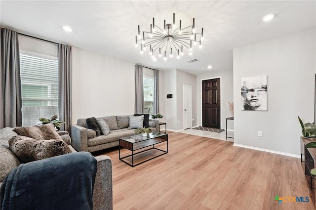 6309 Carriage Pines Dr, Del Valle, TX 78617 - living room featuring a chandelier, recessed lighting, and light wood-style floors