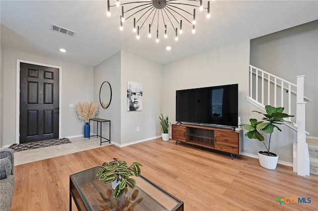 6309 Carriage Pines Dr, Del Valle, TX 78617 - living area featuring visible vents, baseboards, recessed lighting, wood finished floors, and stairs