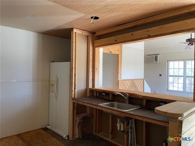 2413 Fuller Dr, Canyon Lake, TX 78133 - kitchen featuring white refrigerator with ice dispenser, ceiling fan, tile countertops, and an AC wall unit