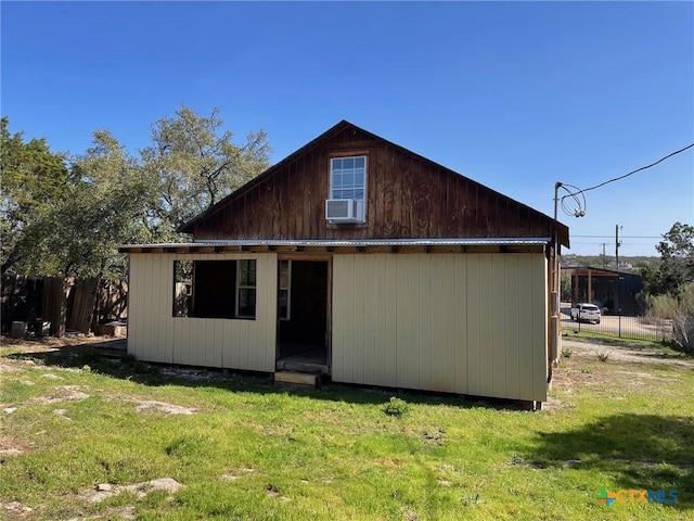 2413 Fuller Dr, Canyon Lake, TX 78133 - rear view of house featuring a lawn
