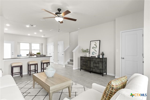 living room with ceiling fan