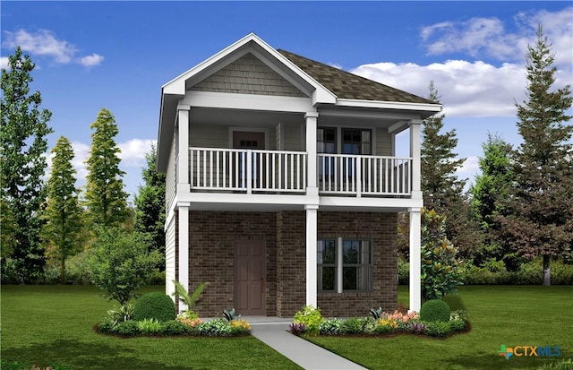 view of front of property with a balcony and a front yard