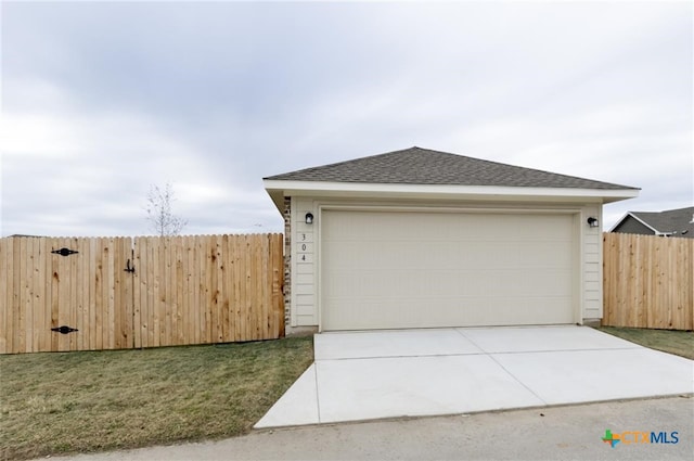 garage with a lawn