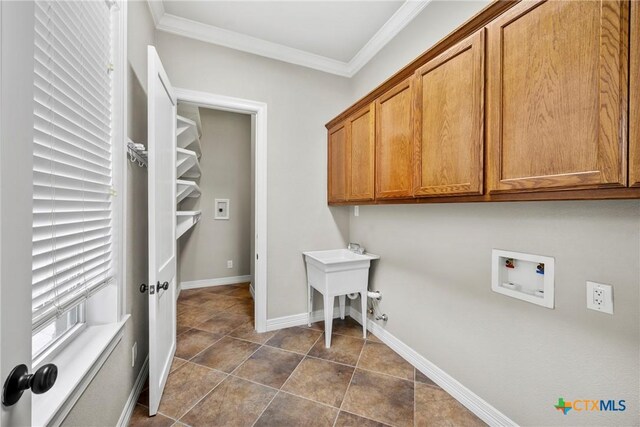 34 Spruce Dr, Belton, TX 76513 - laundry area featuring cabinet space, hookup for a washing machine, crown molding, dark tile patterned floors, and baseboards