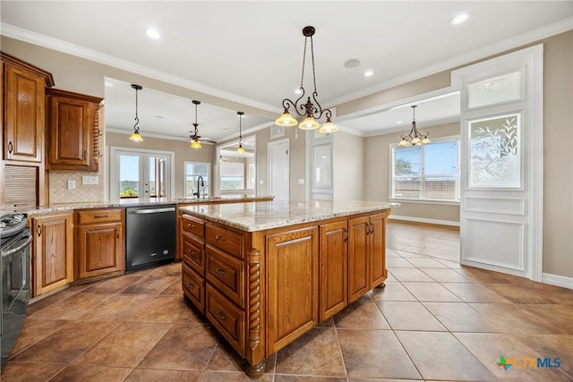 34 Spruce Dr, Belton, TX 76513 - kitchen featuring dishwashing machine, healthy amount of natural light, brown cabinets, a sink, and crown molding