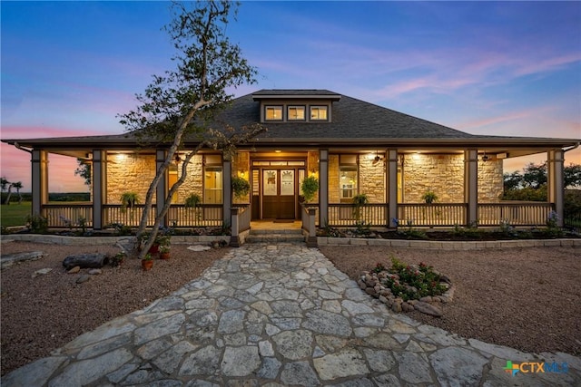 34 Spruce Dr, Belton, TX 76513 - view of front of house with stone siding, a porch, and roof with shingles