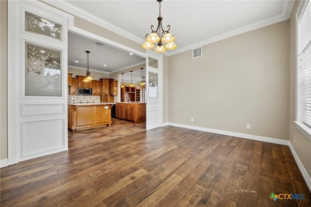 34 Spruce Dr, Belton, TX 76513 - unfurnished living room with a chandelier, dark wood-style floors, ornamental molding, and baseboards