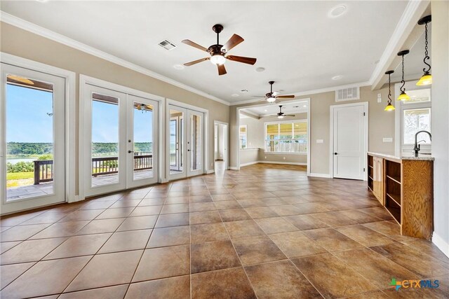 34 Spruce Dr, Belton, TX 76513 - unfurnished living room featuring a ceiling fan, french doors, baseboards, ornamental molding, and recessed lighting
