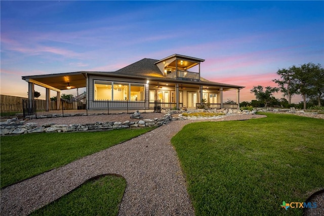 34 Spruce Dr, Belton, TX 76513 - back of house at dusk featuring ceiling fan and a patio