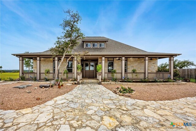 34 Spruce Dr, Belton, TX 76513 - farmhouse-style home featuring covered porch, stone siding, and roof with shingles