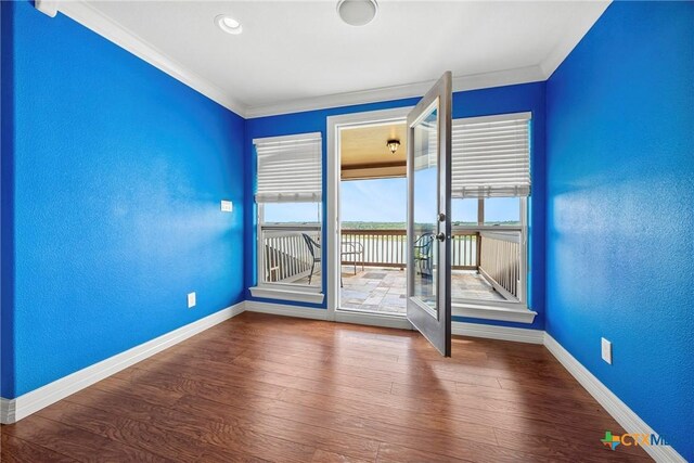 34 Spruce Dr, Belton, TX 76513 - spare room with baseboards, ornamental molding, wood finished floors, a water view, and french doors