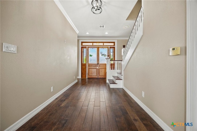 34 Spruce Dr, Belton, TX 76513 - foyer entrance with stairs, baseboards, ornamental molding, dark wood-style flooring, and recessed lighting