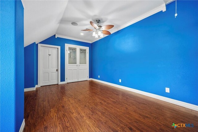 34 Spruce Dr, Belton, TX 76513 - unfurnished bedroom featuring lofted ceiling, dark wood-style floors, baseboards, a ceiling fan, and ornamental molding