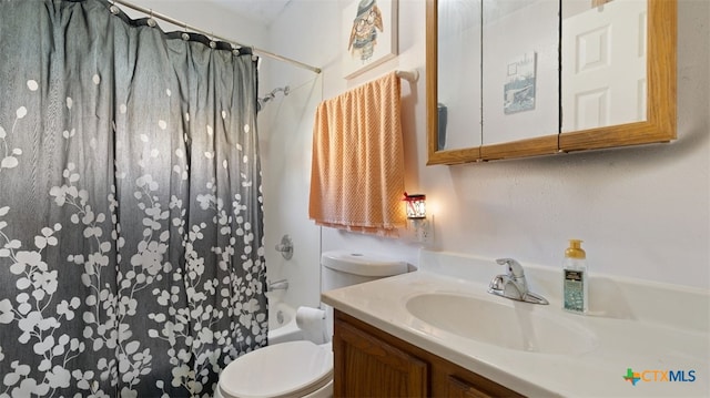 full bathroom with shower / bath combo, vanity, and toilet