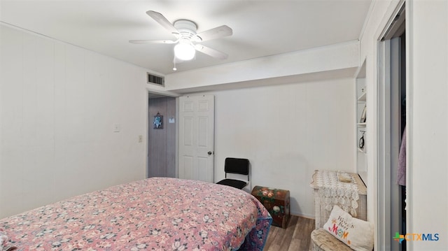 bedroom featuring wood-type flooring and ceiling fan