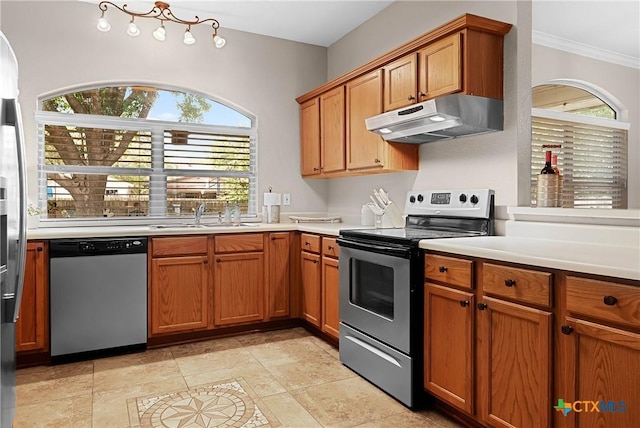 kitchen with under cabinet range hood, stainless steel appliances, a sink, a healthy amount of sunlight, and light countertops