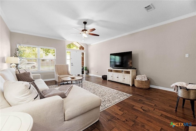 living area featuring dark wood-type flooring, visible vents, and crown molding