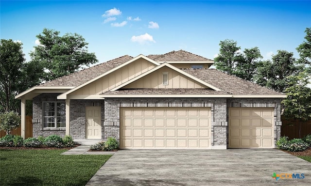 view of front of house featuring a front lawn and a garage