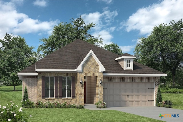 view of front of property featuring a garage and a front yard