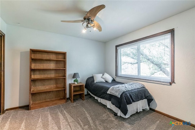 bedroom with carpet floors, ceiling fan, and baseboards