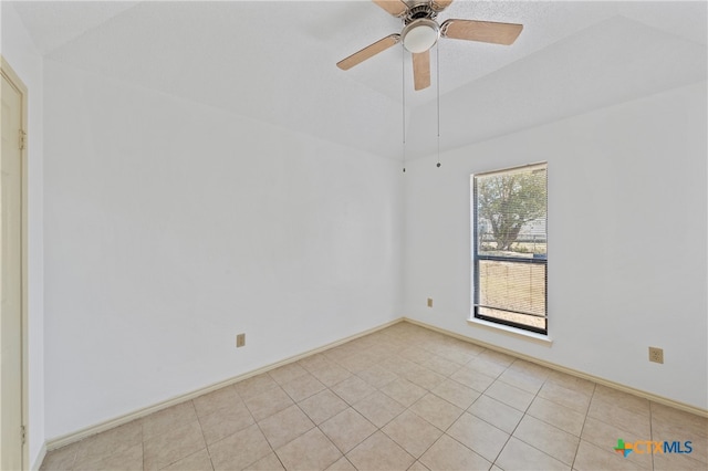 tiled empty room featuring ceiling fan