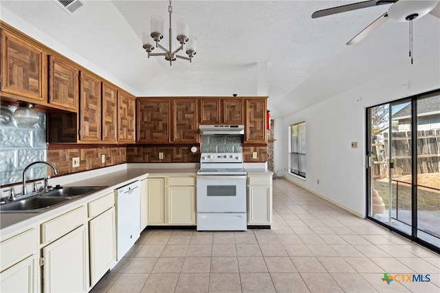 kitchen with white appliances, a healthy amount of sunlight, and sink