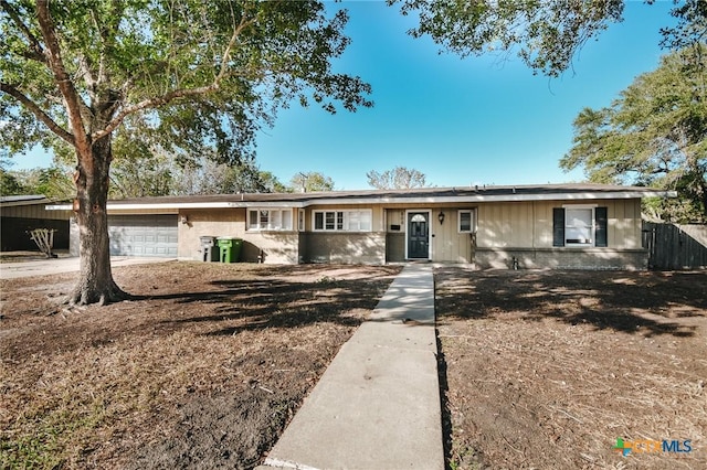 ranch-style home featuring a garage