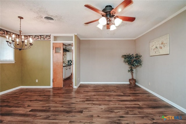 unfurnished room with ceiling fan with notable chandelier, a textured ceiling, dark hardwood / wood-style floors, and ornamental molding