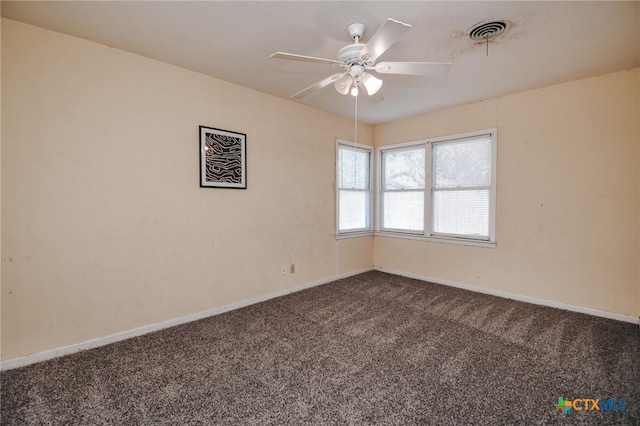 carpeted spare room with ceiling fan