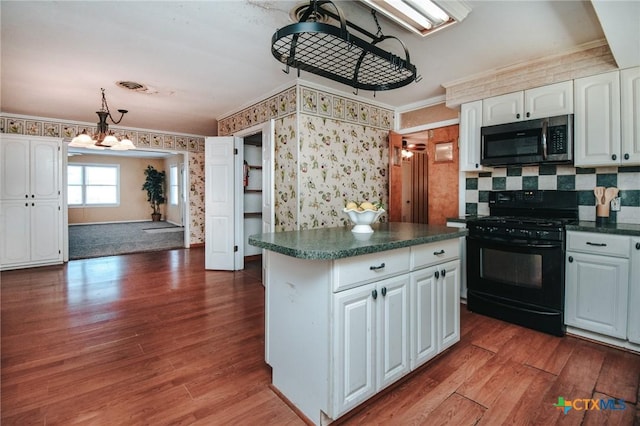 kitchen featuring white cabinetry, black range with gas cooktop, and dark hardwood / wood-style flooring