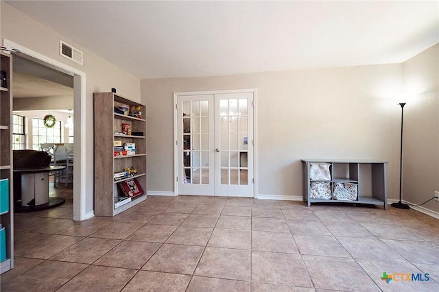 1104 Southridge, Salado, TX 76571 - tiled spare room featuring french doors and baseboards