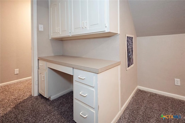 1104 Southridge, Salado, TX 76571 - unfurnished office featuring dark carpet, vaulted ceiling, built in study area, and baseboards