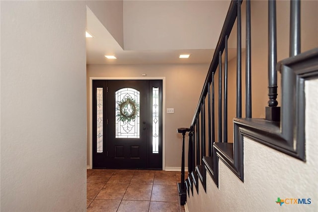 1104 Southridge, Salado, TX 76571 - entryway featuring tile patterned floors, stairway, and baseboards
