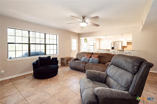1104 Southridge, Salado, TX 76571 - living room with light tile patterned floors, ceiling fan, and baseboards