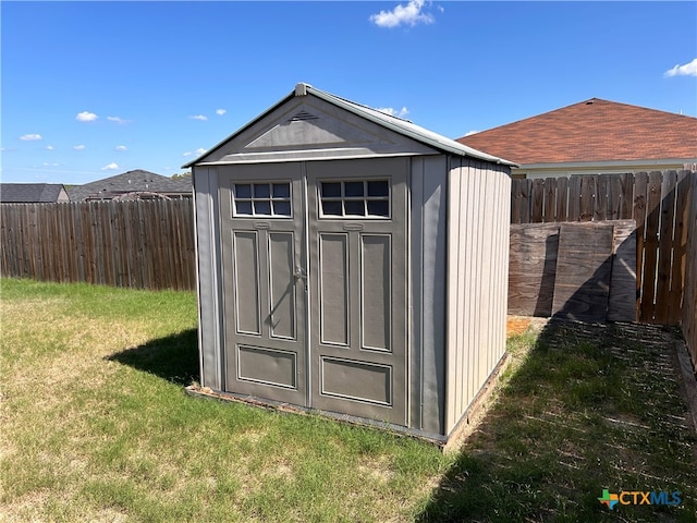 view of outdoor structure with a yard