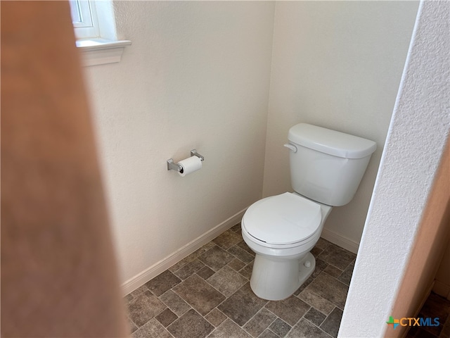 bathroom featuring toilet